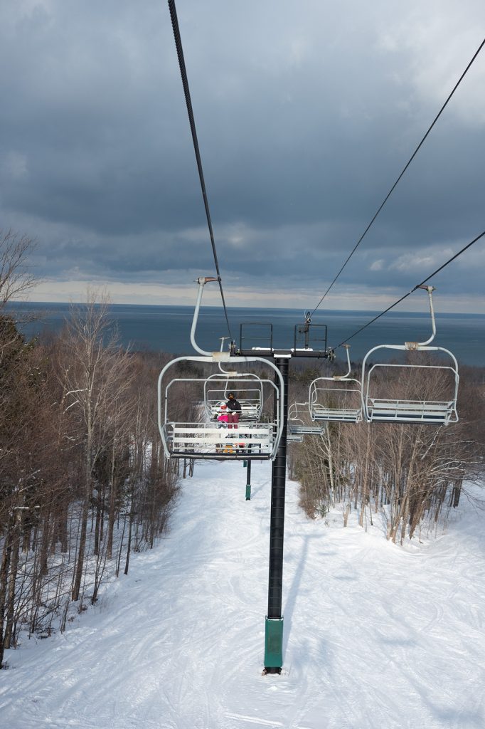 "This lift overlooks Lake Superior and though really pleasant this day, it can be bitterly cold and windy.”  Photo: Kyle Bolen
